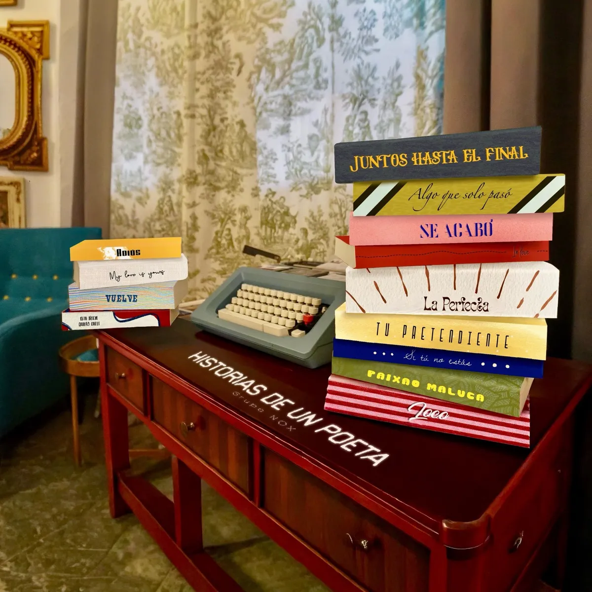 Portada de Historias de un Poeta: los trece libros apilados sobre un escritorio junto a una máquina de escribir